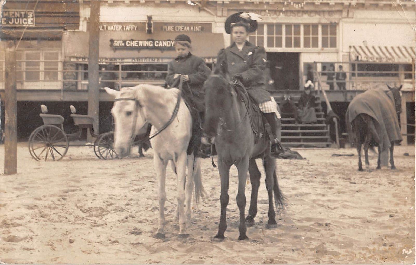 Atlantic City - Horses and riders on the beach with boardwalk backdrop - 1908