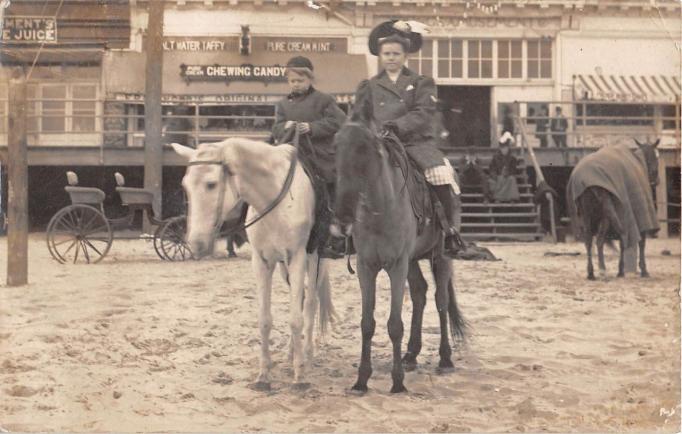 Atlantic City - Horses and riders on the beach with boardwalk backdrop - 1908